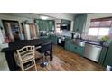 Updated kitchen with stainless steel appliances and custom cabinetry at 7620 Hooker St, Westminster, CO 80030