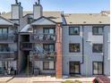 Charming condo with outdoor balconies, a brick chimney and convenient access to the community at 6380 Oak St # 107, Arvada, CO 80004