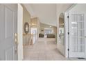 Bright foyer with tile flooring and an open view to the living area at 13649 Plaster Cir, Broomfield, CO 80023