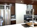 Contemporary kitchen with stainless steel appliances, sleek countertops, and modern cabinetry at 1000 E 1St Ave # 405, Denver, CO 80218