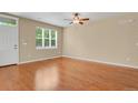 Bright living room with hardwood floors and natural light from large windows at 8260 E 24Th Dr, Denver, CO 80238