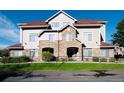 Attractive building exterior with stone accents, well-maintained landscaping, and a beautiful roof at 12711 Colorado Blvd # 912, Thornton, CO 80241