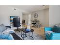 Comfortable living room with a home office area and a keyboard for leisure at 5300 E Cherry Creek South Drive # 918, Denver, CO 80246