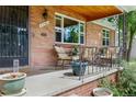 Inviting front porch with seating, showcasing a charming and welcoming entrance at 2240 S Clermont St, Denver, CO 80222