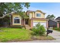 Inviting two-story home with a lush lawn and mature trees offers curb appeal and a warm welcome at 10525 Hobbit Ln, Westminster, CO 80031