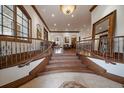 Elegant foyer with grand staircase, hardwood floors, and stunning architectural details at 214 Equinox Dr, Castle Rock, CO 80108