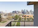 Enjoy breathtaking city views from the balcony of this home at 2090 Eliot St, Denver, CO 80211