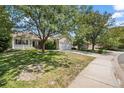 Ranch style home on a tree lined street with a spacious yard at 11480 Moline St, Commerce City, CO 80640