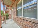 Exterior brick wall with window, showing the side of the townhome with nice views at 5467 Zephyr Ct # 5467, Arvada, CO 80002