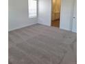 Neutral bedroom with carpeted floors and bright natural light entering through the window at 15286 Fillmore St, Thornton, CO 80602
