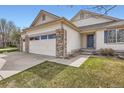 Inviting single-Gathering home featuring a three-car garage and a well-maintained front lawn at 15870 Duckweed Ct, Parker, CO 80134