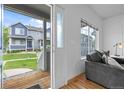 Bright living room with stylish decor, hardwood floors and a view of the front yard at 19216 E Idaho Pl # 102, Aurora, CO 80017