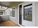 Charming front porch with wood flooring and neutral siding at 19216 E Idaho Pl # 102, Aurora, CO 80017