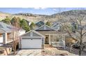 Nice curb appeal! This lovely Ranch home boasts a 2-car garage and mature trees at 1337 N Ford St, Golden, CO 80403