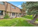 Full exterior view showcasing the townhome's architecture and landscaping at 12931 W 20Th Ave, Golden, CO 80401