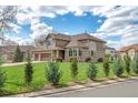Stunning two-story home featuring lush green lawn and mature landscaping at 14461 Inca Ct, Westminster, CO 80023