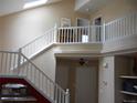 Spacious foyer with a staircase and an upper balcony at 19692 E Mann Creek Dr # D, Parker, CO 80134