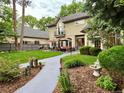 Beautiful backyard with lush green lawn, landscaping, patio seating, and an exterior view of the home at 1160 Monaco Pkwy, Denver, CO 80220