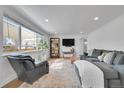 Inviting living room with hardwood floors, lots of natural light, and stylish furniture at 2544 S Raleigh St, Denver, CO 80219