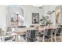 Bright dining room with modern decor, stylish chairs, and ample natural light at 1919 Bellaire St, Denver, CO 80220