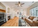 Cozy living room with a fireplace and hardwood floors at 1311 Carlyle Park Cir, Highlands Ranch, CO 80129