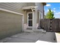 Inviting front entrance featuring a neutral door, brick accents, and well-maintained surroundings at 5154 E 126Th Ct, Thornton, CO 80241