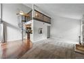 Open living space featuring a spiral staircase, and a view of the upper-level loft at 9797 E Peakview Ave # C10, Englewood, CO 80111