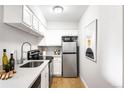 Charming kitchen featuring stainless steel appliances, sleek countertops, and ample storage at 4110 Hale Pkwy # 3K, Denver, CO 80220