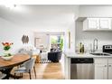 Bright living room with stainless steel appliances and an open floor plan at 4110 Hale Pkwy # 3K, Denver, CO 80220