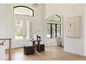 Bright foyer featuring soaring windows, hardwood floors and a modern, open layout at 8937 Little Raven Trl, Niwot, CO 80503