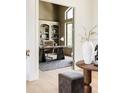 Charming home office with built-in shelving, neutral tones and large window at 8937 Little Raven Trl, Niwot, CO 80503