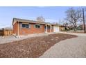 Picture of the home exterior with a red brick exterior and well maintained landscaping at 8331 Mason Cir, Westminster, CO 80031