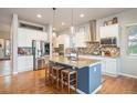 Spacious kitchen with a large island, stainless steel appliances, and ample counter space at 1788 Holmby Ct, Castle Rock, CO 80104