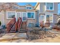 Exterior view of townhouses with stone and wood details at 1885 S Quebec Way # L102, Denver, CO 80231
