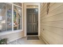 Charming front entryway featuring a decorative glass window and a solid wood door at 14400 Albrook Dr # 43, Denver, CO 80239