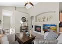 Inviting living room with a fireplace, TV, and comfortable seating, perfect for relaxing and enjoying the ambiance at 22610 E Ontario Dr # 204, Aurora, CO 80016