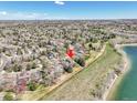 Overhead view of property near lake with lush greenery and beautiful surroundings at 2590 W Long Cir, Littleton, CO 80120