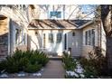 Charming front entrance with double doors and landscaping at 4530 S Verbena St # 309, Denver, CO 80237