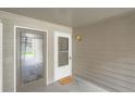 Condo entryway featuring unit number, welcome mat, and a secure, well-lit entrance at 2575 S Syracuse Way # B107, Denver, CO 80231