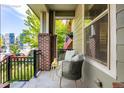 Inviting front porch with seating area, perfect for relaxing outdoors at 8482 Parkland St, Broomfield, CO 80021