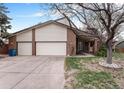 Charming home featuring a spacious three-car garage and well-maintained landscaping at 3312 S Ouray Way, Aurora, CO 80013