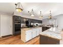 Spacious kitchen with large island, granite countertops, and modern appliances at 3312 S Ouray Way, Aurora, CO 80013
