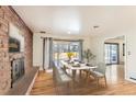Bright dining room with hardwood floors and sliding glass doors at 558 S Pontiac Way, Denver, CO 80224