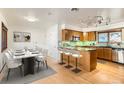 Updated kitchen featuring wood cabinets and granite countertops at 558 S Pontiac Way, Denver, CO 80224