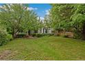 Beautiful house with a large, well-manicured lawn and mature trees providing ample shade at 1900 S Gilpin St, Denver, CO 80210
