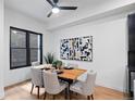 Bright dining area featuring a modern table setting, stylish chairs, and contemporary artwork on the wall at 2010 Pearl St # B, Boulder, CO 80302