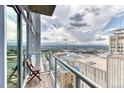 Enjoy the city views from this balcony featuring glass railings, wooden flooring and comfortable seating at 891 14Th St # 2002, Denver, CO 80202