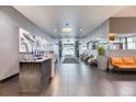 Modern lobby with reception desk, comfortable seating, and contemporary decor at 891 14Th St # 2002, Denver, CO 80202