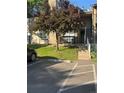 Cozy apartment exterior with a private balcony, reserved parking, and a well-maintained lawn at 1850 S Pitkin Cir # B, Aurora, CO 80017