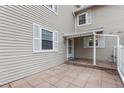Cozy patio area of home exterior featuring stone tile at 3274 S Heather Gardens Way, Aurora, CO 80014